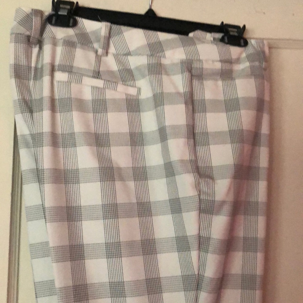 White pants with black stripes.